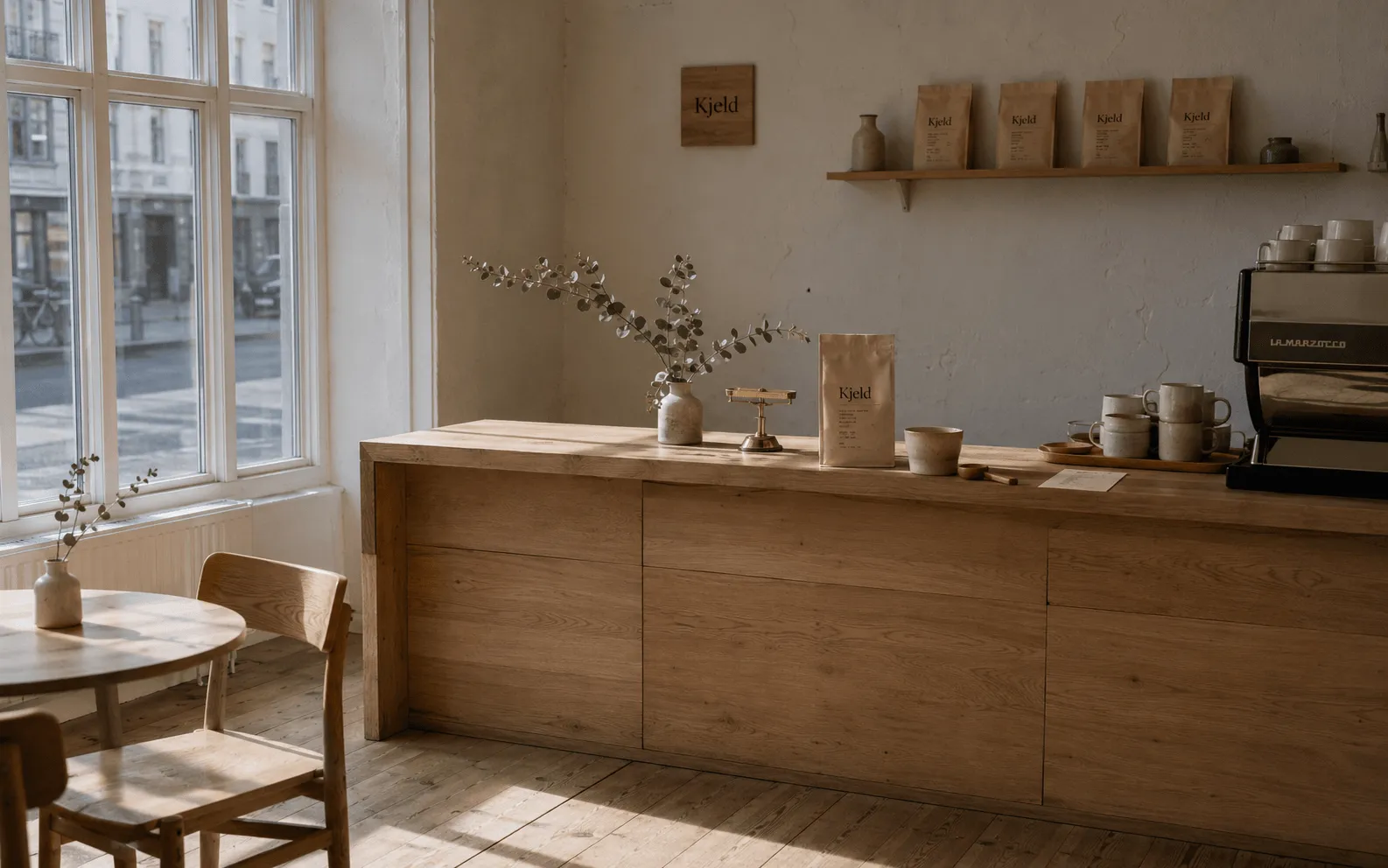 Kjeld brand campaign — coffee shop interior, morning light